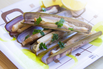seafood, razor clams grilled with oil and parsley