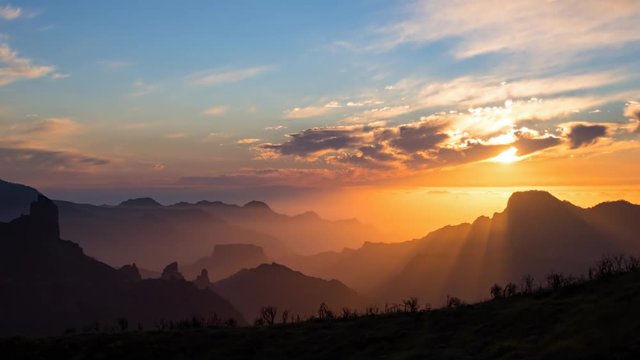 Day to night sunset time lapse over volcanic caldera of Tejeda, Gran Canaria, Canary islands, Spain.