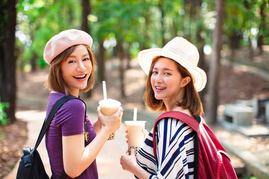 happy girls drinking bubble tea and enjoy summer vacation - Powered by Adobe