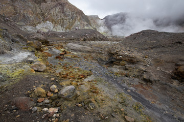 Hot mud and boilng sulphuric acid water on the lahar field, White Island active volcano, New Zealand