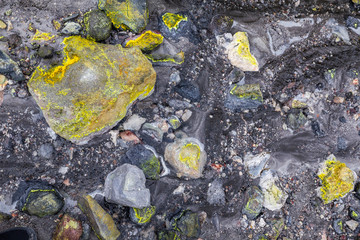 Hot mud and boilng sulphuric acid water on the lahar field, White Island active volcano, New Zealand