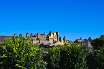 Fototapeta na wymiar Wonderful medieval city of Carcassonne with yellow sign of tour de France