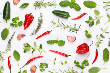 Spice herbal leaves and chili pepper on white background. Vegetables pattern. Floral and vegetables on white background. Top view, flat lay.
