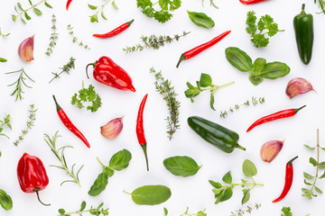 Spice herbal leaves and chili pepper on white background. Vegetables pattern. Floral and vegetables on white background. Top view, flat lay.