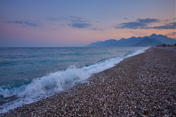 Konyaalti sand beach and Taurus mountains in the early morning light, Antalya, Turkey