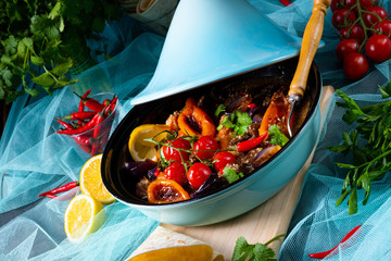 Tasty spicy beef with various vegetables cooked in tagine