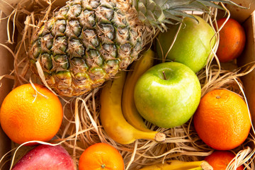 fruit boxes. apple, orange, banana, pineapple 