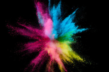 Colored powder explosion. Abstract closeup dust on backdrop. Colorful explode. Paint holi