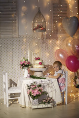 child tastes cake decorated with lively flowers