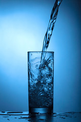 Water pours into the glass