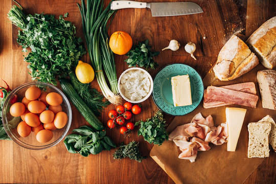 Top shot of assorted fresh food on a wooden table