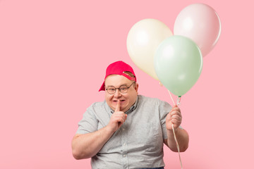 Plump softie man much similar to Winnie the Pooh asks to keep secret that he has air baloons on the...
