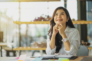 Portrait of young businesswoman sitting at her office.