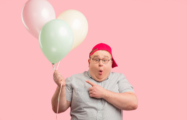 Surprised amazed emotional tubby animator wearing glasses and red baseball cap, opening mouth...