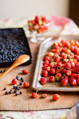 Close-up of strawberries and blueberries on a wooden Board. Breakfast, summer, cottage