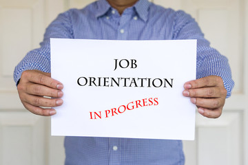 Job orientation in progress, words printed on white paper