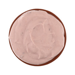 Small bowl of red raspberry yogurt on a white background top view