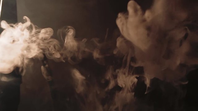 thick white smoke from a hookah on a black background
