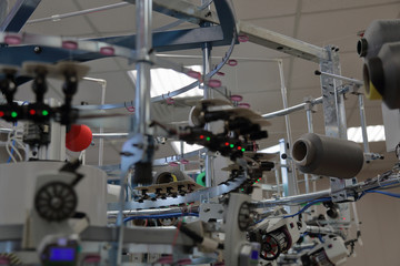 Automatic line for sewing clothes from synthetic and knitted fabrics