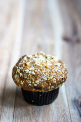 Banana muffin on wooden background.