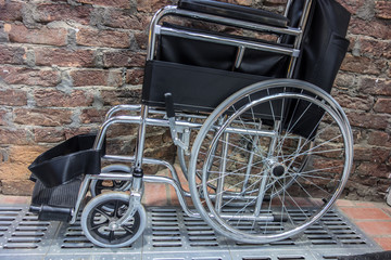 Fototapeta premium Folded wheelchair. Public toilet