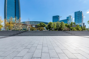 Panoramic skyline and modern business office buildings with empty road,empty concrete square floor