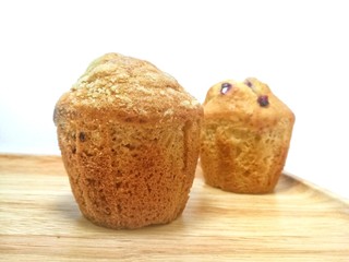 Banana muffins on a wooden table
