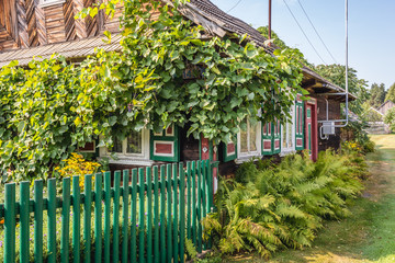 Wooden folk cottage in Soce, small village in Podlasie region of Poland