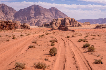 Car tracks in Wadi Rum also known as Valley of light or Valley of sand in Jordan