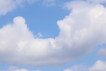White clouds against the blue sky.