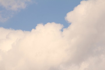 Obraz premium White clouds against the blue sky.