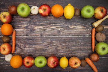 Fruits and vegetables frame on table