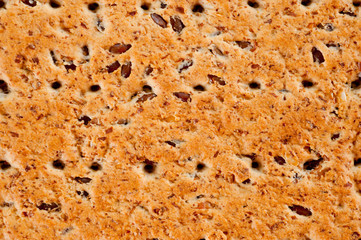 Dieting cookies with flax seeds and sunflower seeds and cracknels on the background