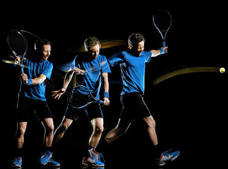 Plakat one caucasian tennis player man isolated black background in light painting speed motion multiple exposure