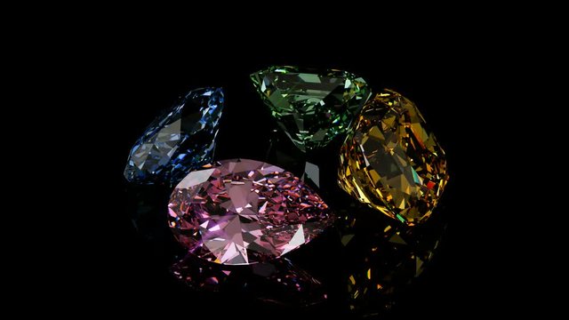 Four multi colored diamonds rotating on black glossy background. Seamless loop 3D animation