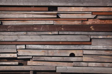 Wall of wooden boards with slits. Texture of old , brown wood