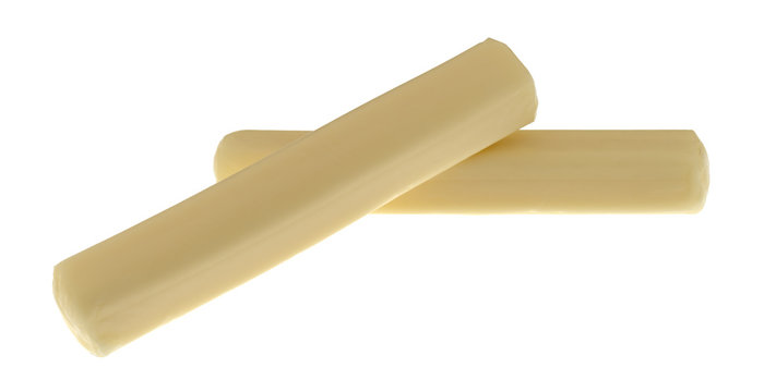 Two pieces of mozzarella snack string cheese on a white background