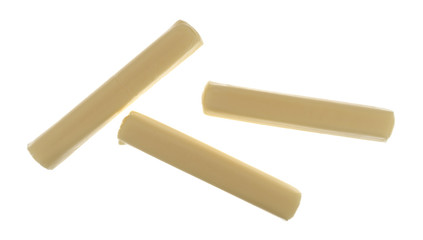 Three pieces of mozzarella snack string cheese on a white background top view