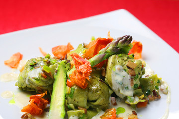 salad of artichokes, ratatouille and asparagus in parmesan cream