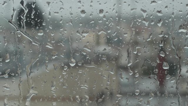 Bad weather. View from a window. Raindrops on the glass.