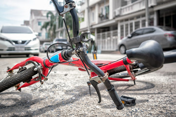 Children's Bicycle Laying on the Tarmac in a Traffic Accident.