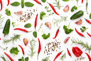 Spice herbal leaves and chili pepper on white background. Vegetables pattern. Floral and vegetables on white background. Top view, flat lay.