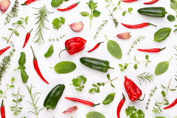 Spice herbal leaves and chili pepper on white background. Vegetables pattern. Floral and vegetables on white background. Top view, flat lay.