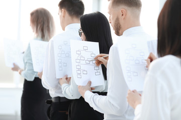 employee with a marketing scheme standing in line for an interview
