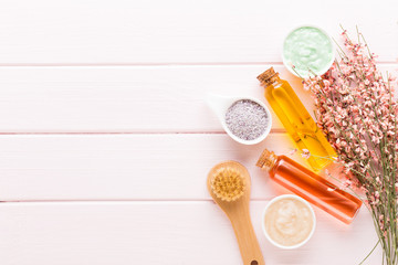 Beauty and fashion concept with spa set on pastel rustic wooden background.