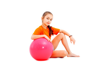 Fitness girl holding pilates ball.