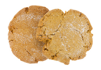 Two molasses cookies isolated on a white background top view