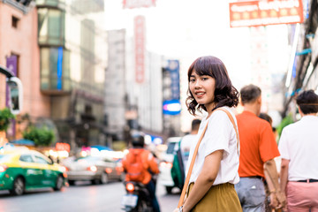 Young Asian Woman Traveler with view at China Town in Bangkok, Thailand