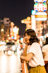 Young Asian Woman Traveler with view at China Town in Bangkok, Thailand