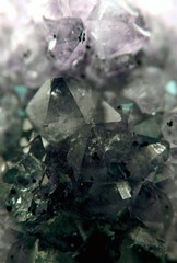 Gemstone Quartz closeup as a part of cluster geode filled with rock crystals.